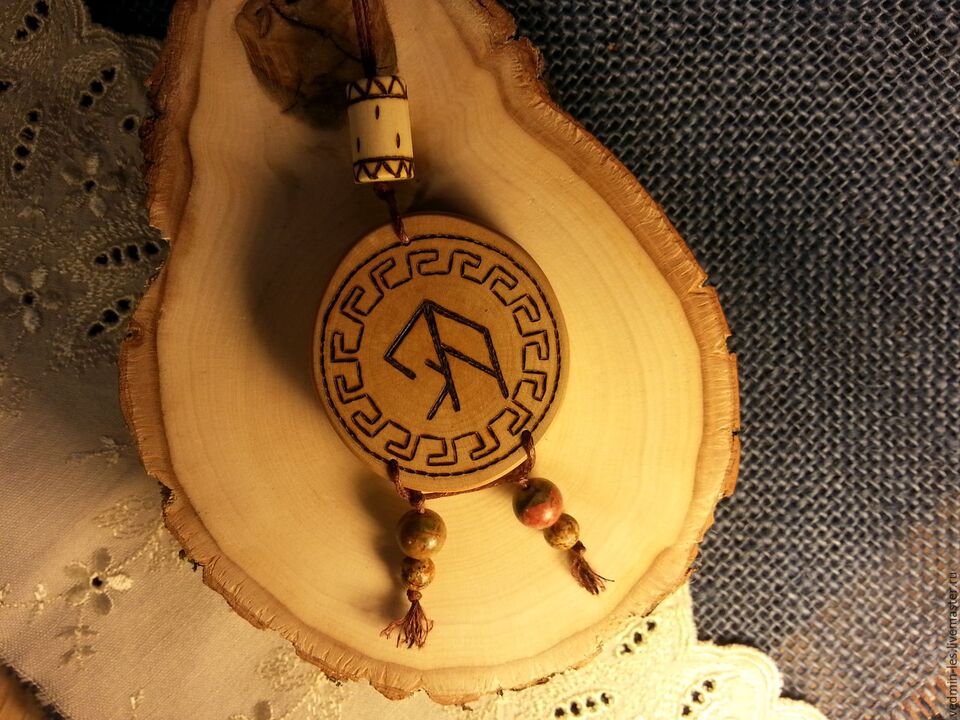 Amulet with rune for luck Figure 1
